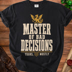 Black t-shirt with gold text: "MASTER OF BAD DECISIONS YOURS, MOSTLY". Dragon graphic above text.
