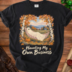 Black t-shirt with ghost in hammock and text "Haunting My Own Business".