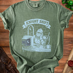 Green t-shirt graphic of a knight at a computer with text "KNIGHT SHIFT".