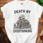White t-shirt with "Death by Overthinking" text and a skeleton graphic.