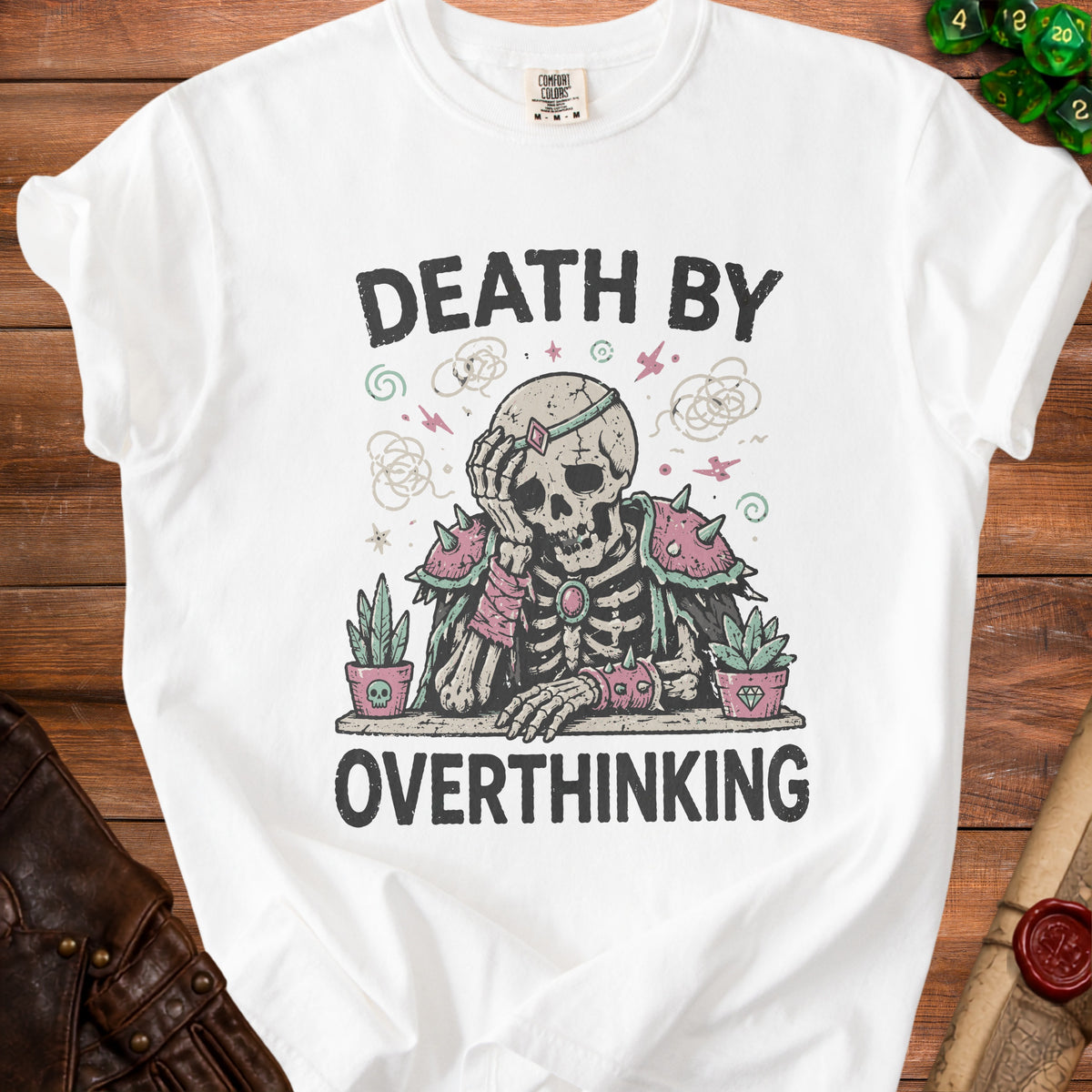 White t-shirt with "Death by Overthinking" text and a skeleton graphic.
