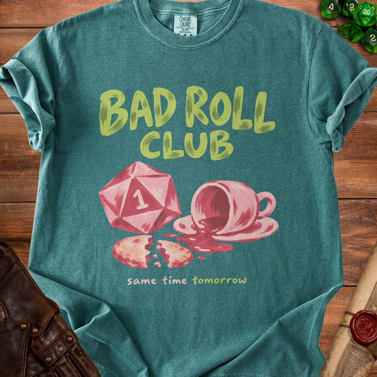 Teal t-shirt with "BAD ROLL CLUB" and spilled coffee graphic.