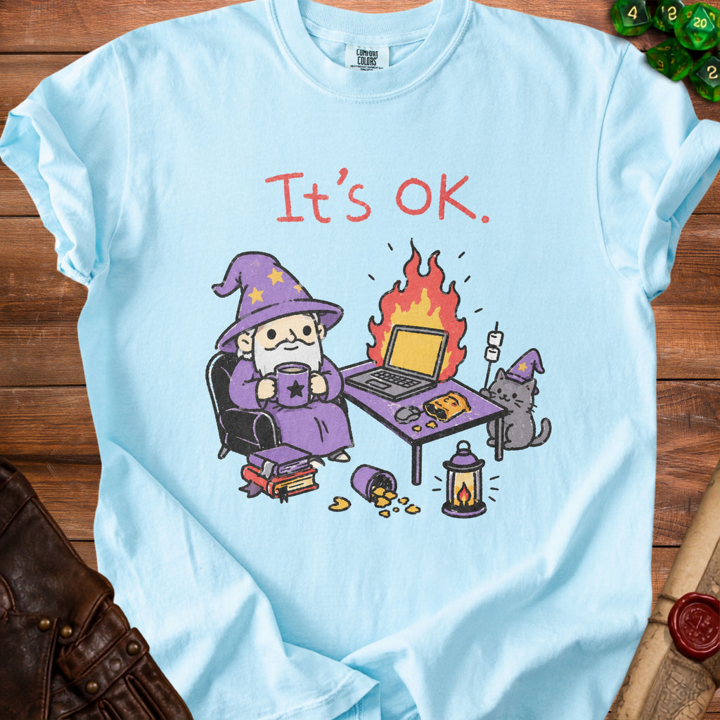Light blue t-shirt with wizard, cat, laptop, and text "It's OK."