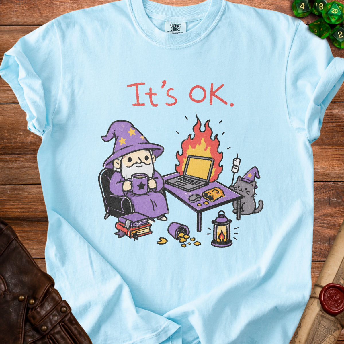 Light blue t-shirt with wizard, cat, laptop, and text "It's OK."