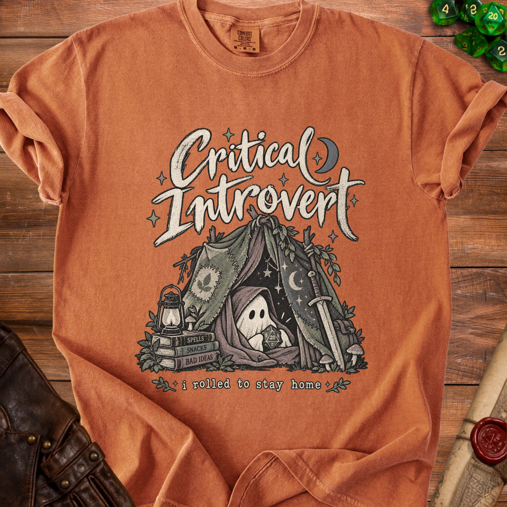 Orange t-shirt with "Critical Introvert" graphic of a ghost in a tent holding a d20.