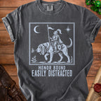 Gray t-shirt graphic of knight on dog with text "Honor Bound Easily Distracted".