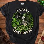 Skeleton witch in a hat waters plants with text "I CAST LEAF GROWTH".
