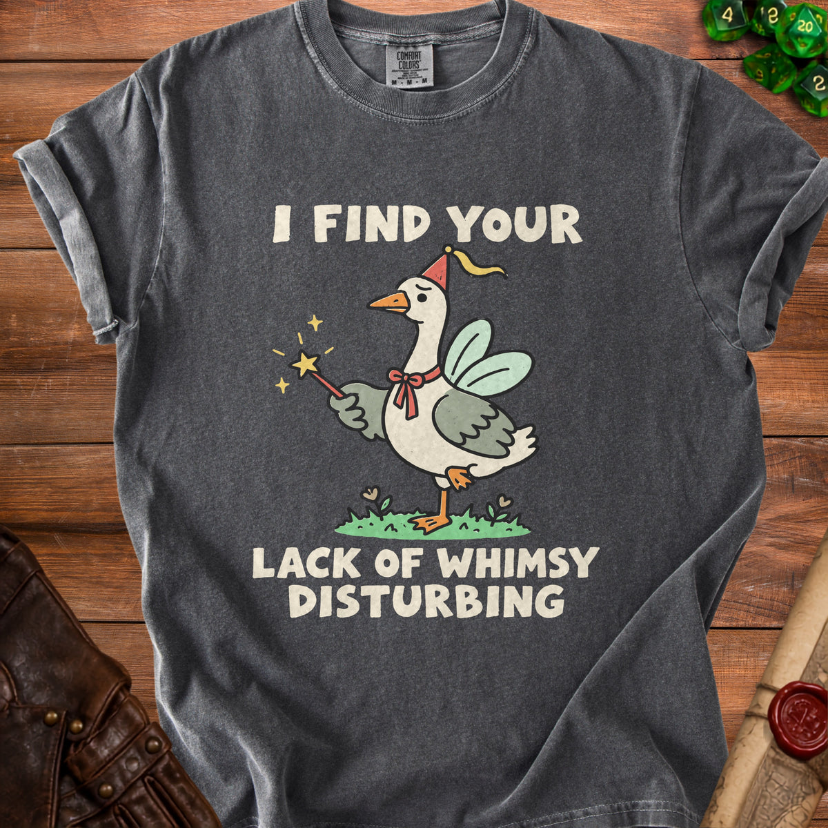 Gray t-shirt with goose in party hat holding magic wand, text "I FIND YOUR LACK OF WHIMSY DISTURBING".