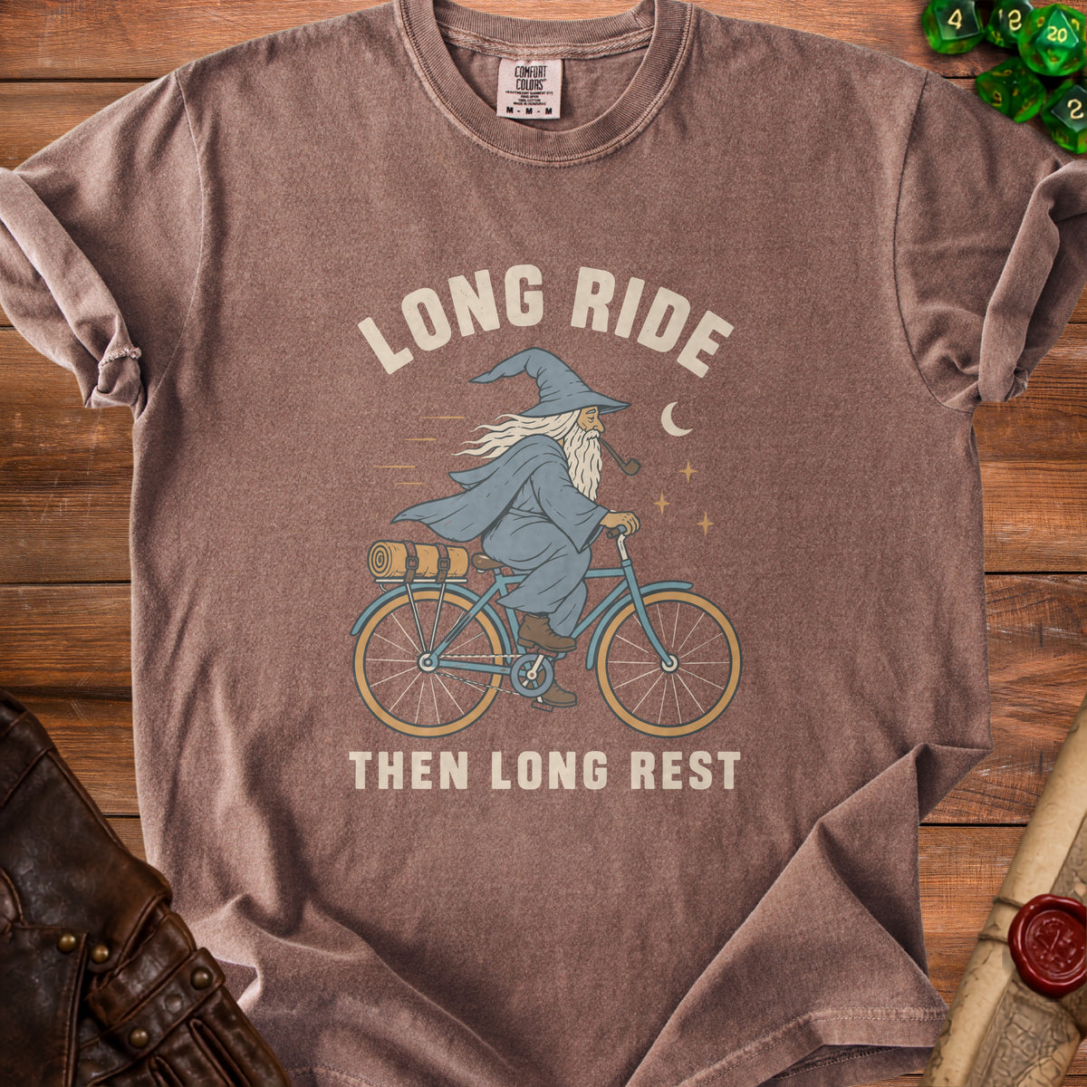 Brown t-shirt with wizard on bicycle graphic and text "Long Ride Then Long Rest".