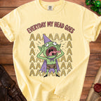 Yellow t-shirt with cartoon goblin graphic and text "EVERYDAY MY HEAD GOES".