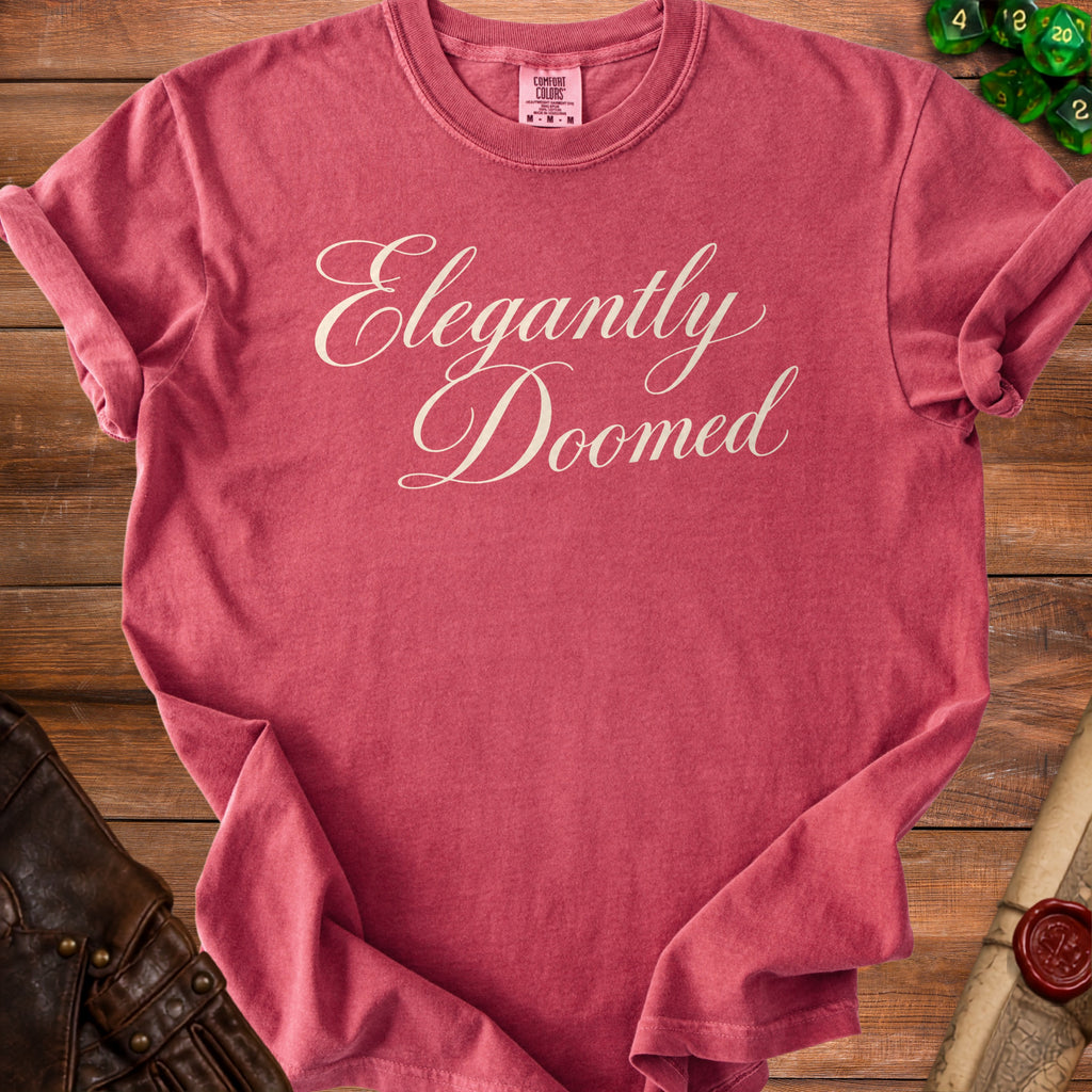 T-shirt with "Elegantly Doomed" text in cursive.