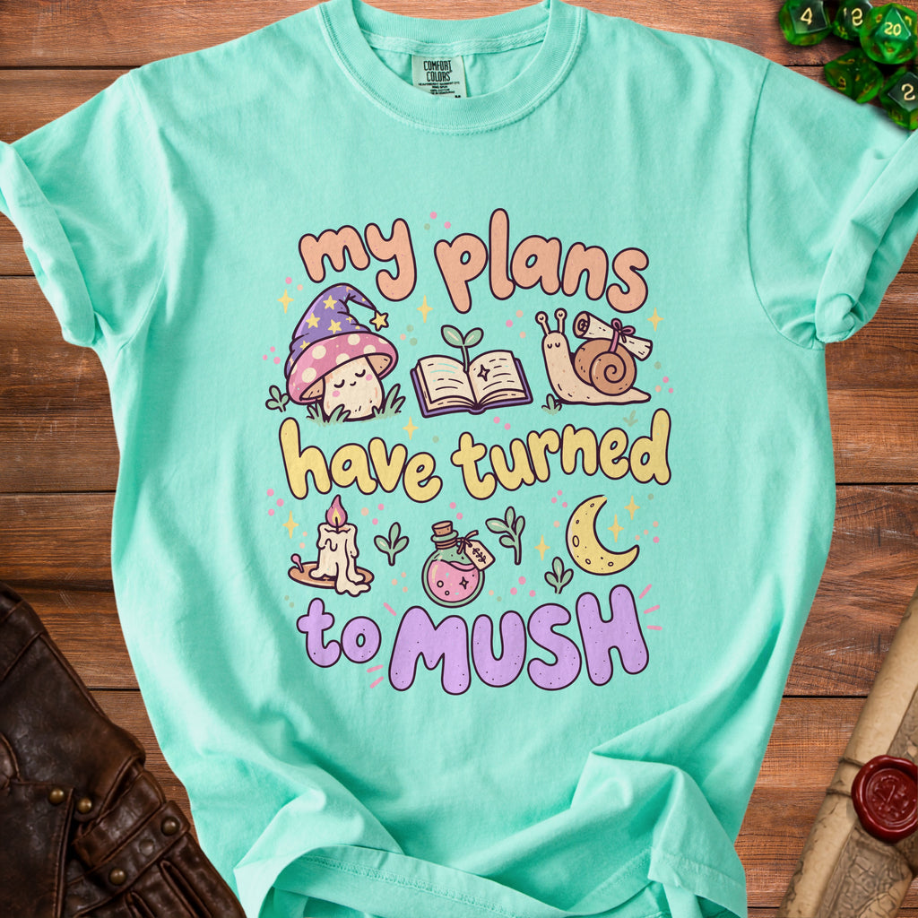 Teal t-shirt with "my plans have turned to mush" text and whimsical illustrations.