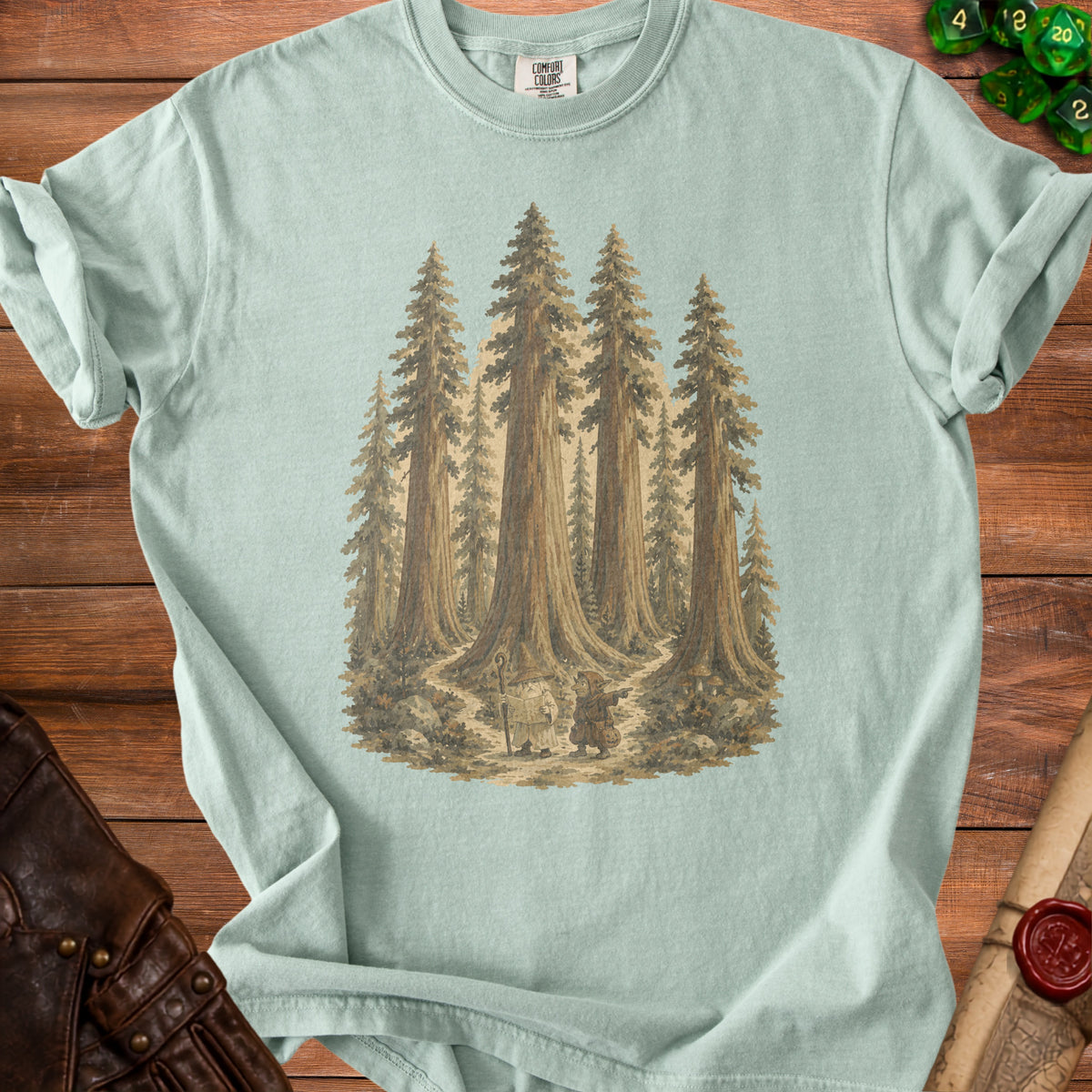 Pale green t-shirt with a vintage illustration of a wizard and gnome in a redwood forest.
