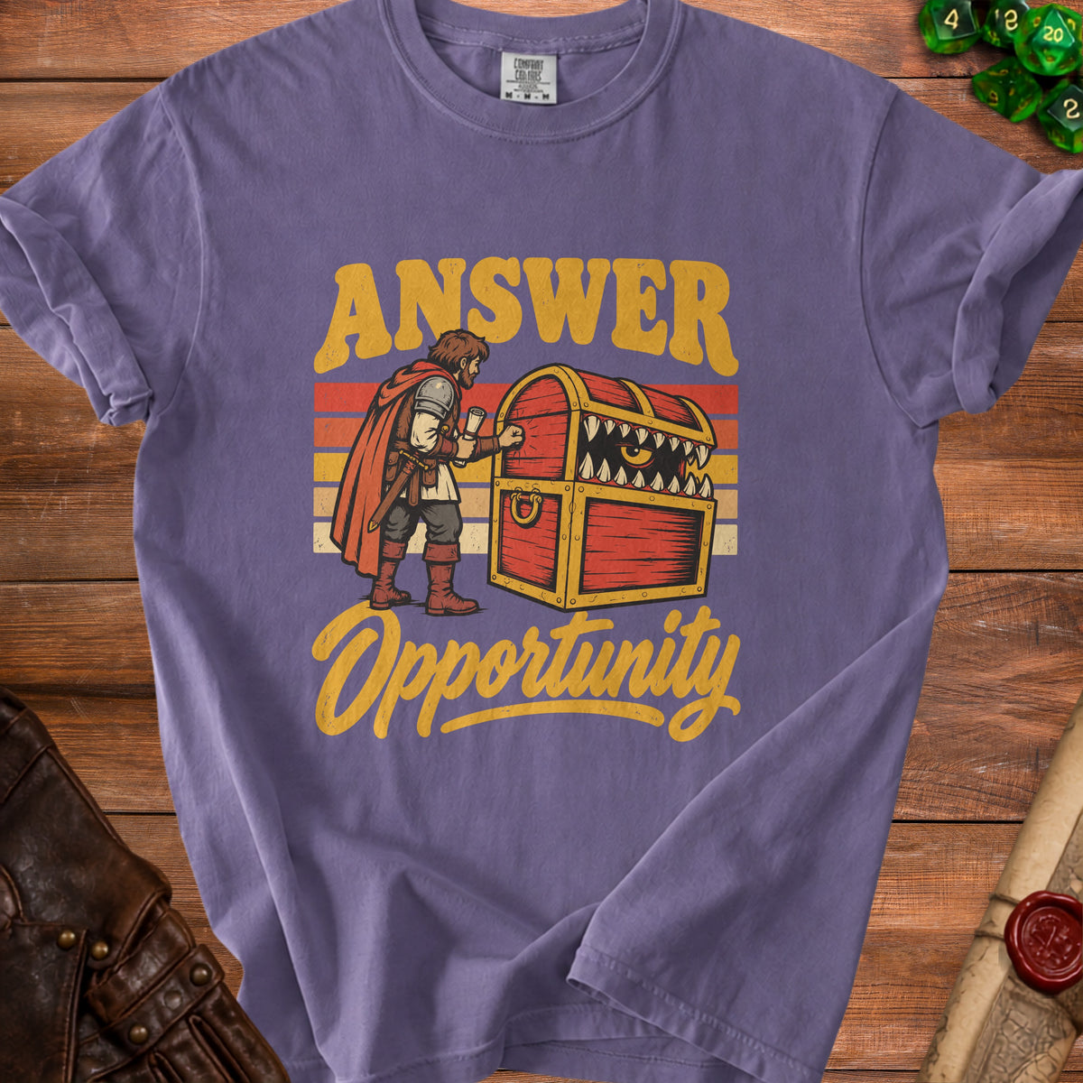 Purple t-shirt with text "Answer Opportunity" and a warrior facing a monster chest.