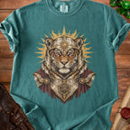 Tiger wearing knight armor with sunburst and a d20 die on a teal shirt.
