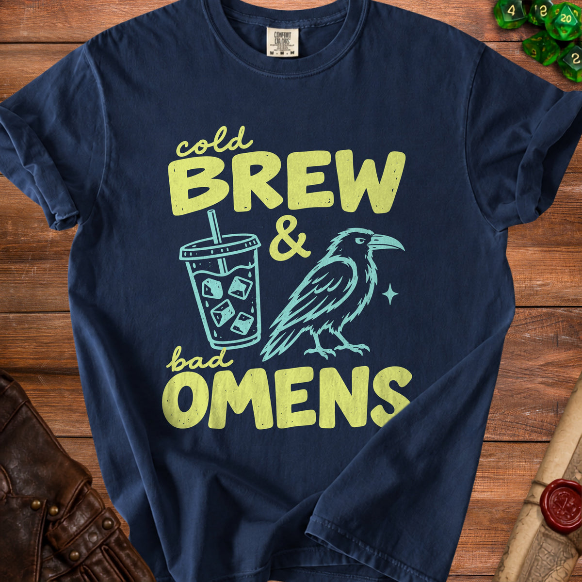Navy t-shirt with "Cold Brew & Bad Omens" text, a raven, and a drink.
