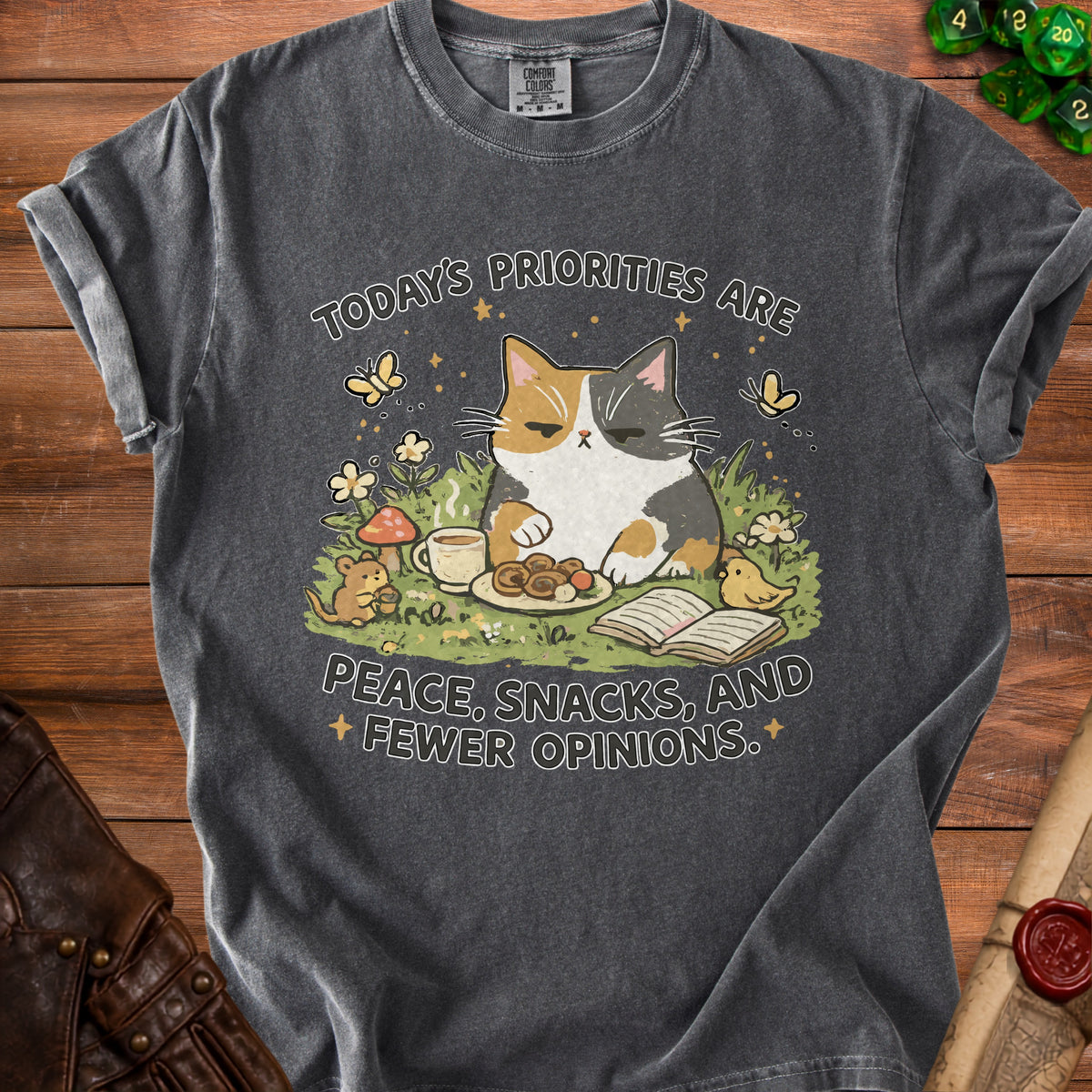 Grey t-shirt with a calico cat, mouse, and bird graphic reading "Today's priorities are peace, snacks, and fewer opinions."