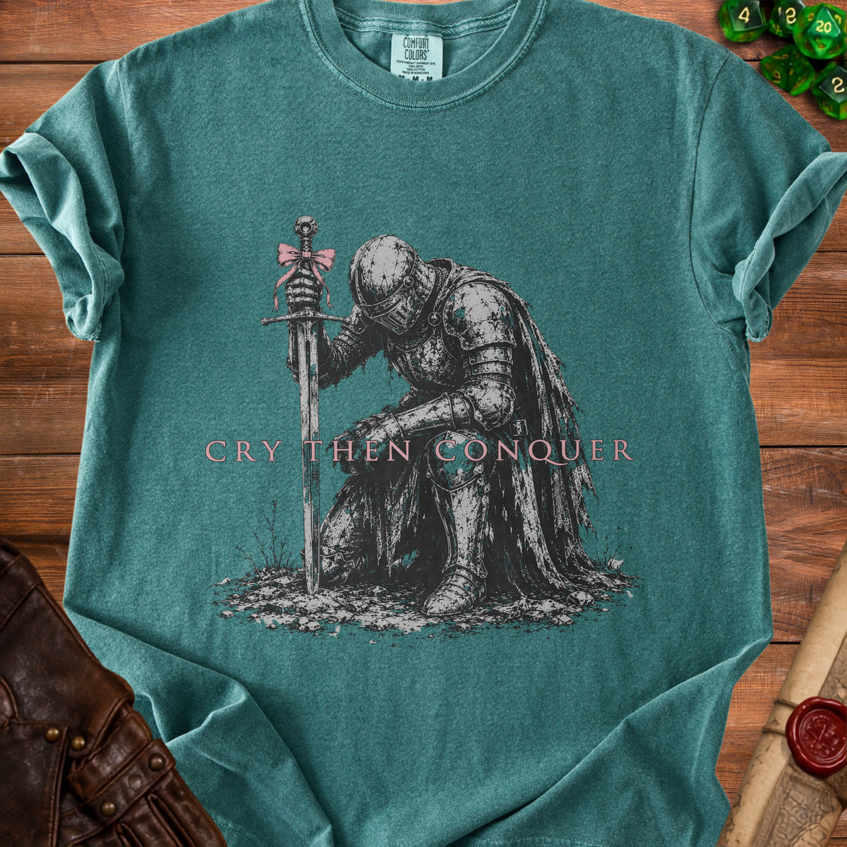 Knight kneeling with sword, text reads "CRY THEN CONQUER".