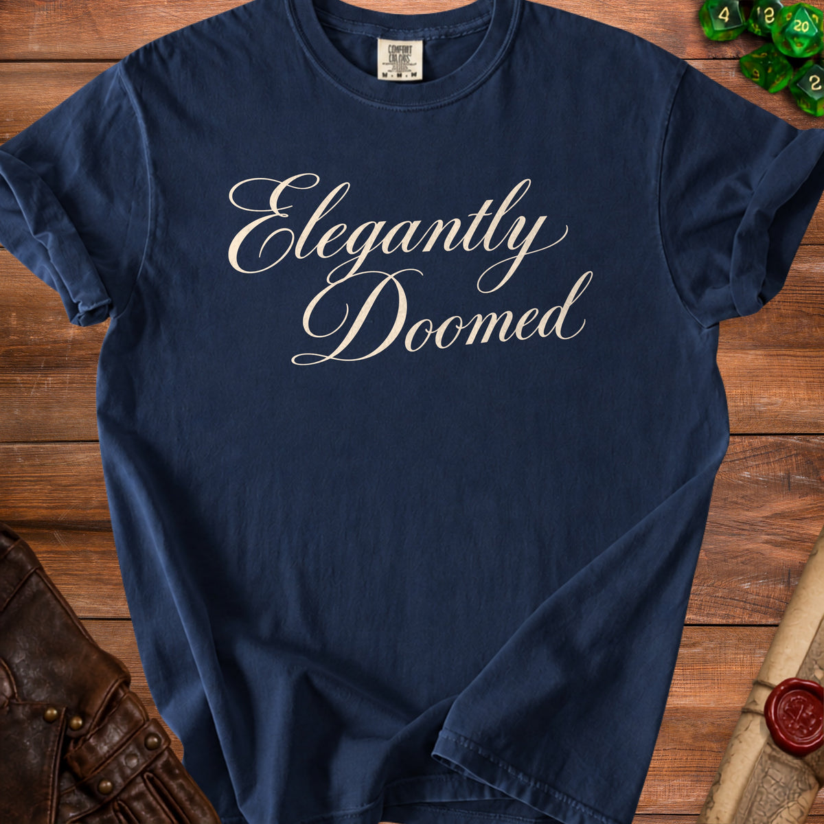 Navy t-shirt with "Elegantly Doomed" written in cursive script.