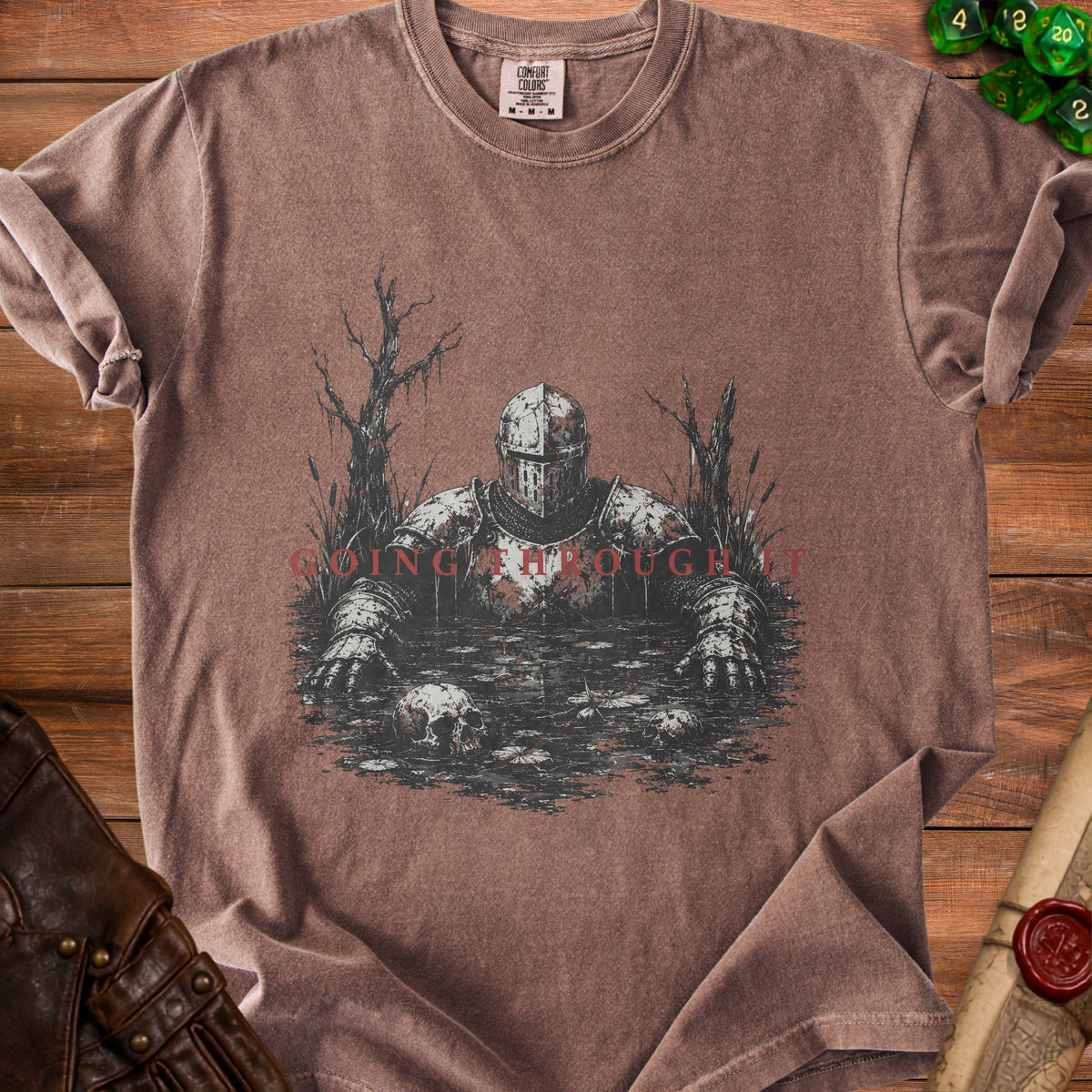 T-shirt with knight in swamp graphic and red text "GOING THROUGH IT".