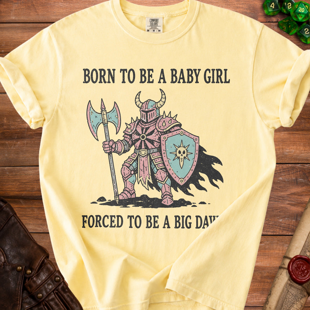 Yellow t-shirt with medieval knight graphic and text "BORN TO BE A BABY GIRL FORCED TO BE A BIG DAD".