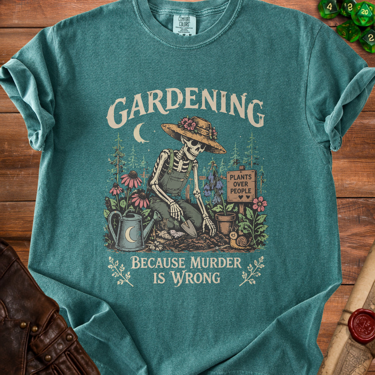 T-shirt graphic of a skeleton gardening with text "Gardening" and "Because Murder Is Wrong".