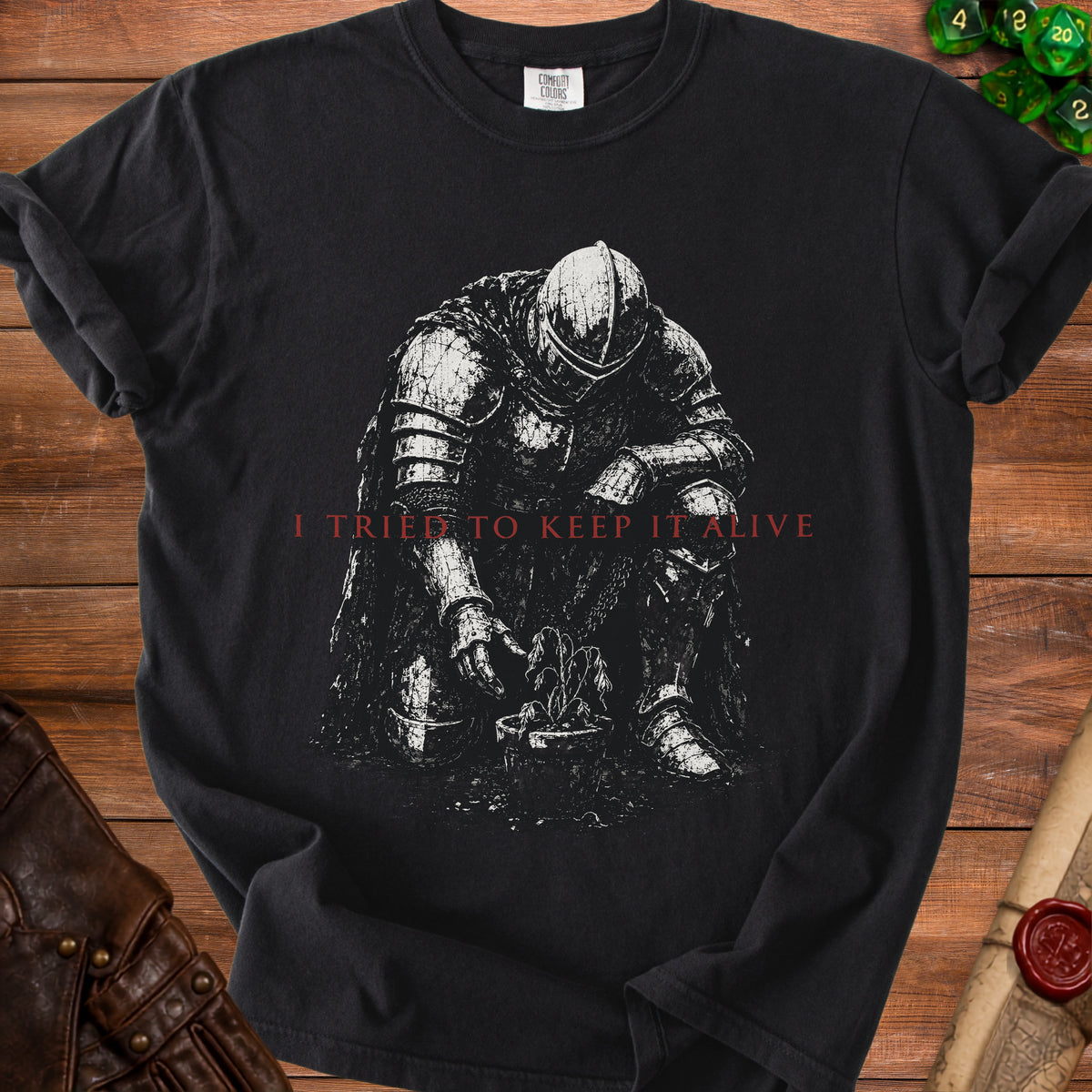 Black t-shirt with knight tending to a wilting plant and text "I TRIED TO KEEP IT ALIVE".
