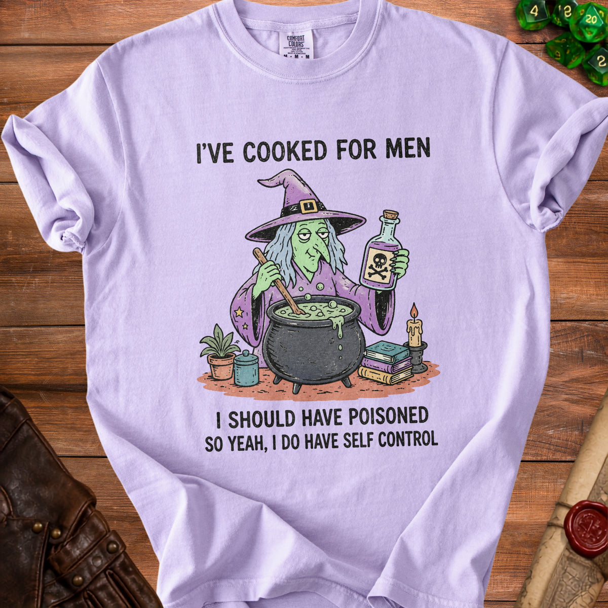 Light purple t-shirt with a witch and cauldron graphic and text "I'VE COOKED FOR MEN" and "I SHOULD HAVE POISONED SO YEAH, I DO HAVE SELF CONTROL".