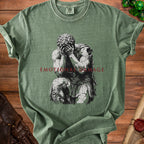 Green t-shirt with cracked statue graphic and "EMOTIONAL DAMAGE" text.