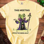 Yellow t-shirt with a cartoon goat wizard and text "THIS MEETING COULD'VE BEEN AN E".
