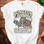 White t-shirt with "Dungeon Looting Society" text and raccoon character with treasure chest.
