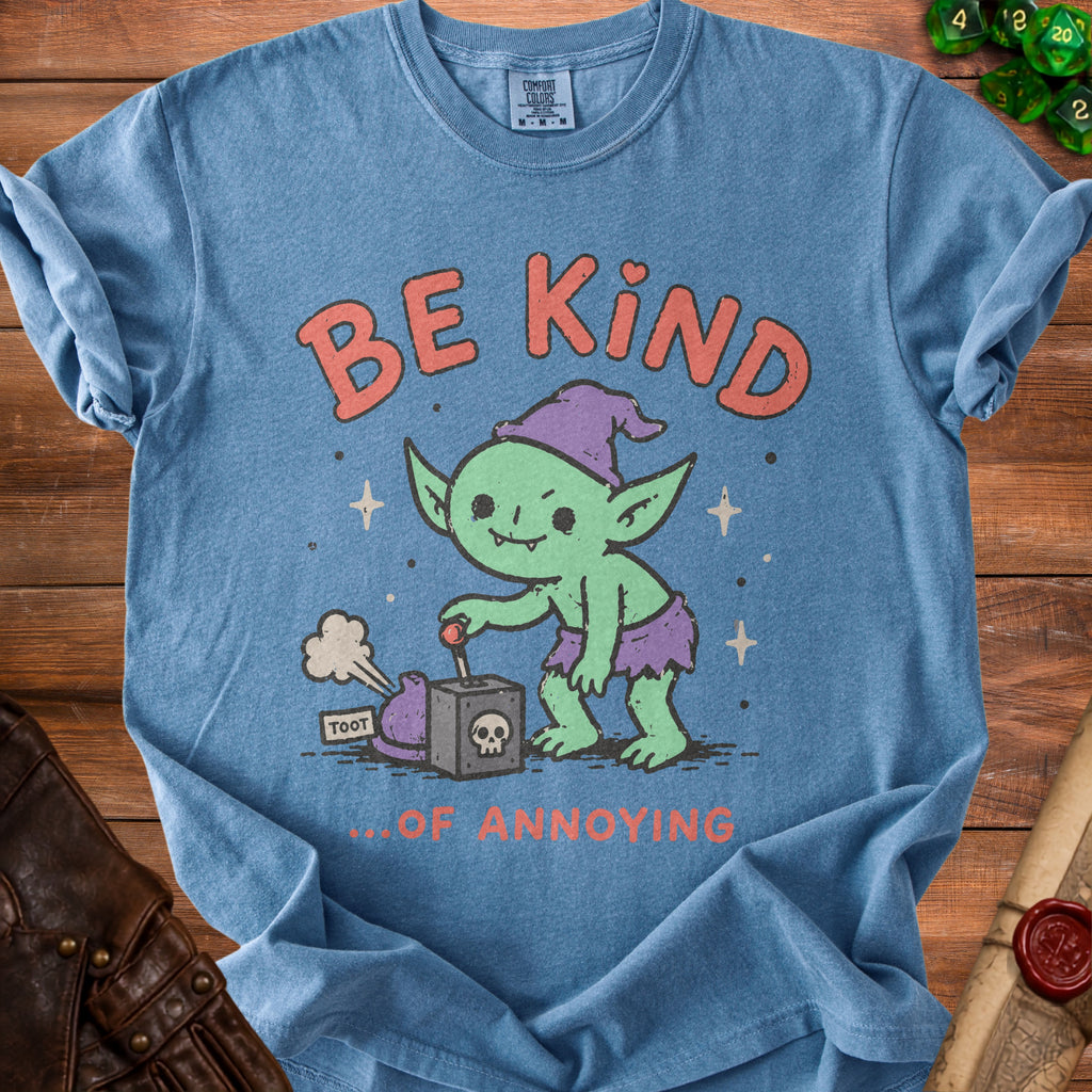 Blue t-shirt with green goblin graphic saying "BE KIND ...OF ANNOYING".