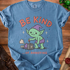 Blue t-shirt with green goblin graphic saying "BE KIND ...OF ANNOYING".