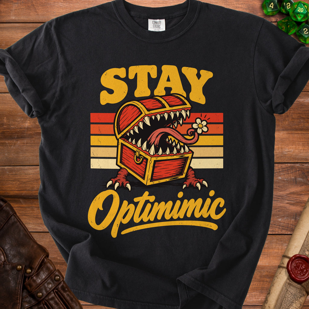 Black t-shirt with "STAY Optimimic" text and a monster chest graphic.