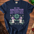 Navy t-shirt with "Be the ancestor they summon when shit gets real" text and graphic.
