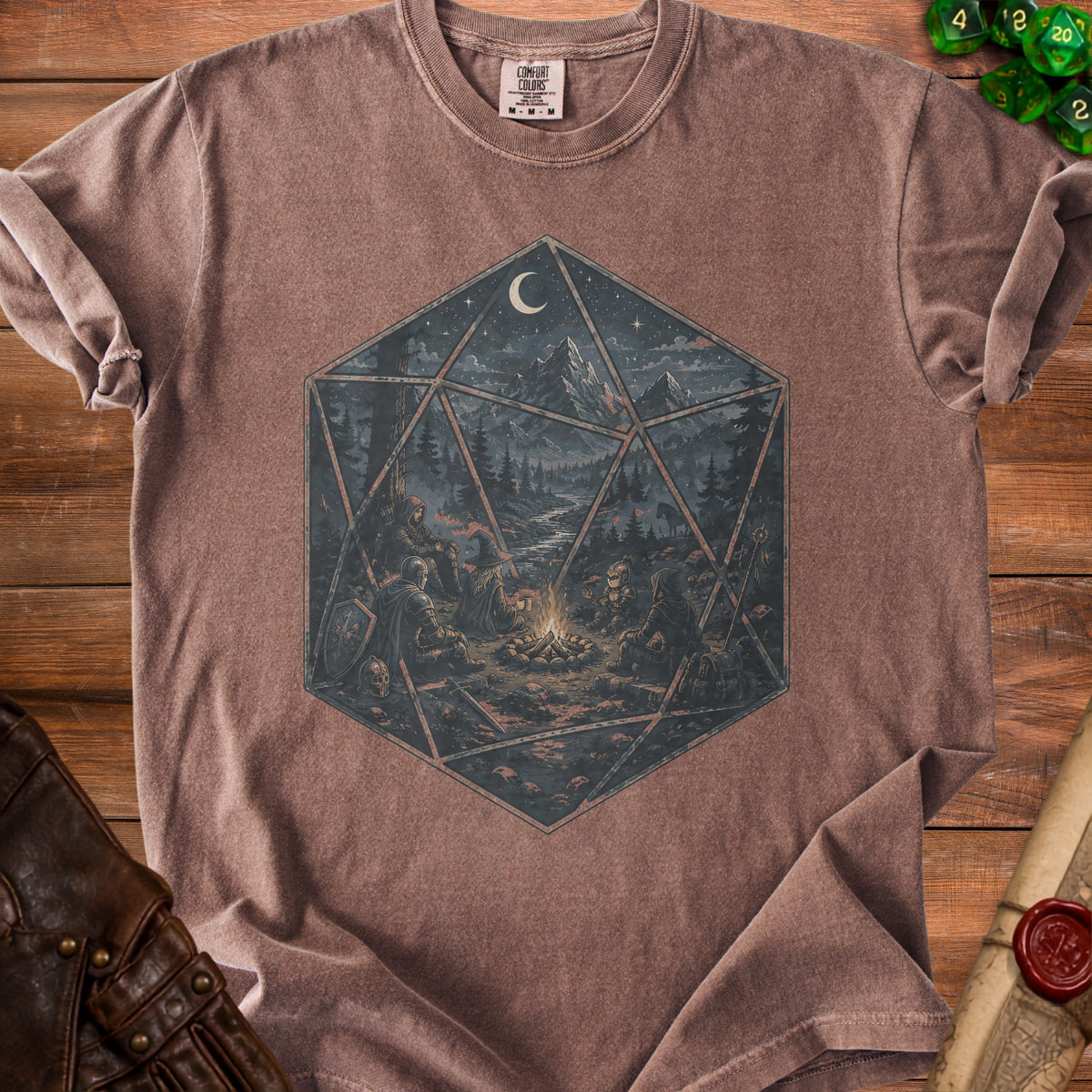 Brown t-shirt with a D20 dice design of adventurers around a campfire.