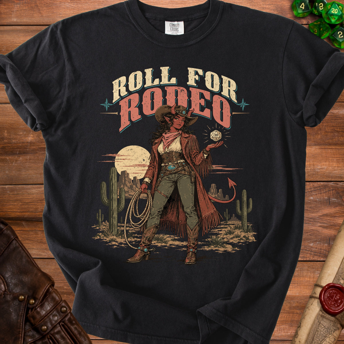 Black t-shirt with "Roll For Rodeo" text and a cowgirl character holding a lasso and dice.