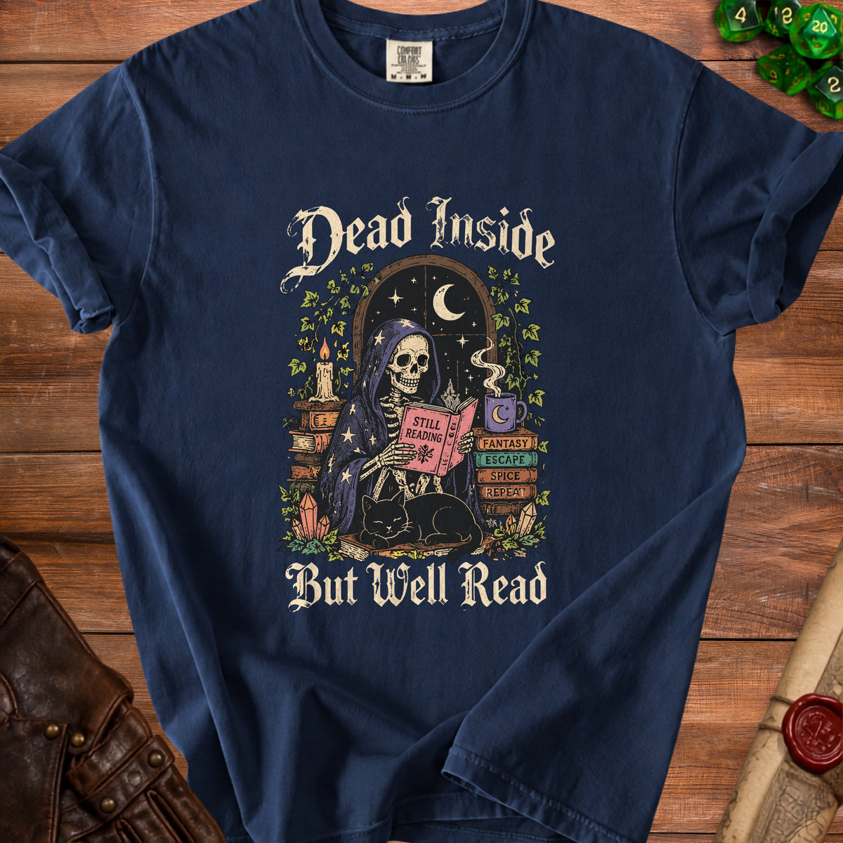 Skeleton reading a book with a cat, text says "Dead Inside But Well Read".