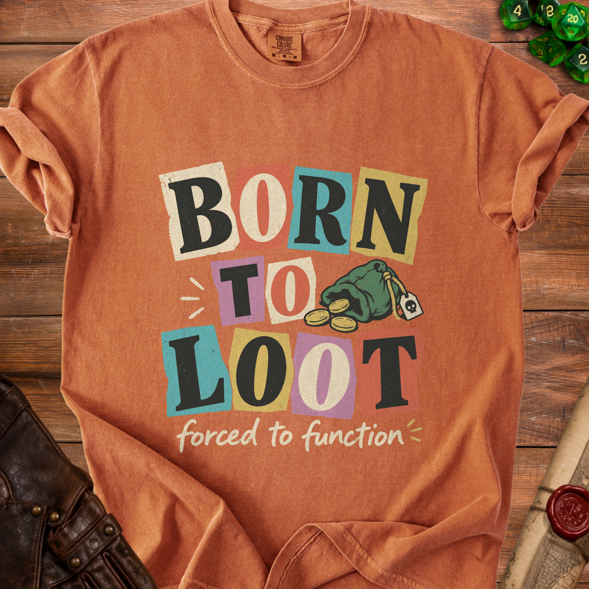 Orange t-shirt with "BORN TO LOOT forced to function" text and treasure bag graphic.
