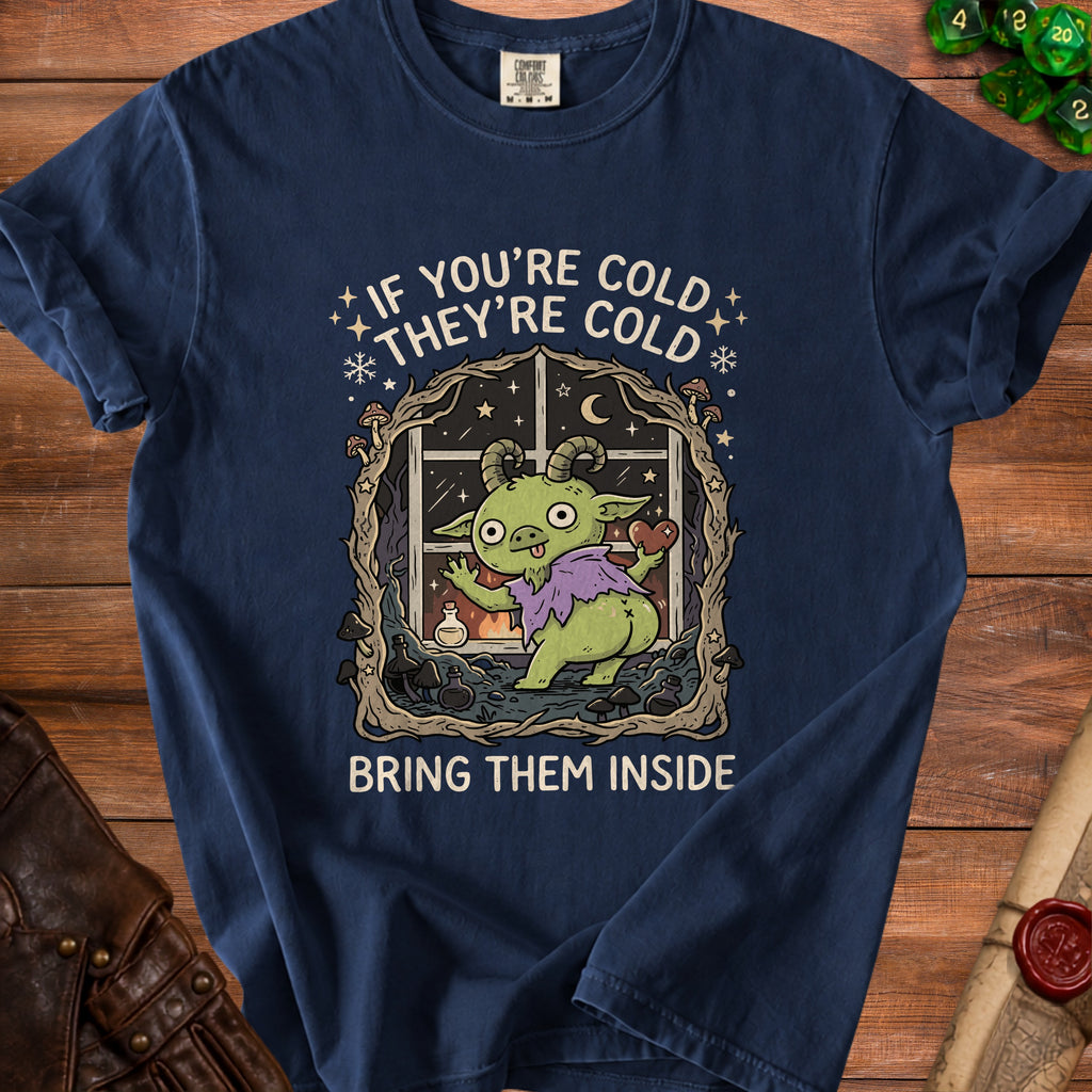 Dark navy t-shirt with a graphic of a green creature and text "IF YOU'RE COLD THEY'RE COLD BRING THEM INSIDE".