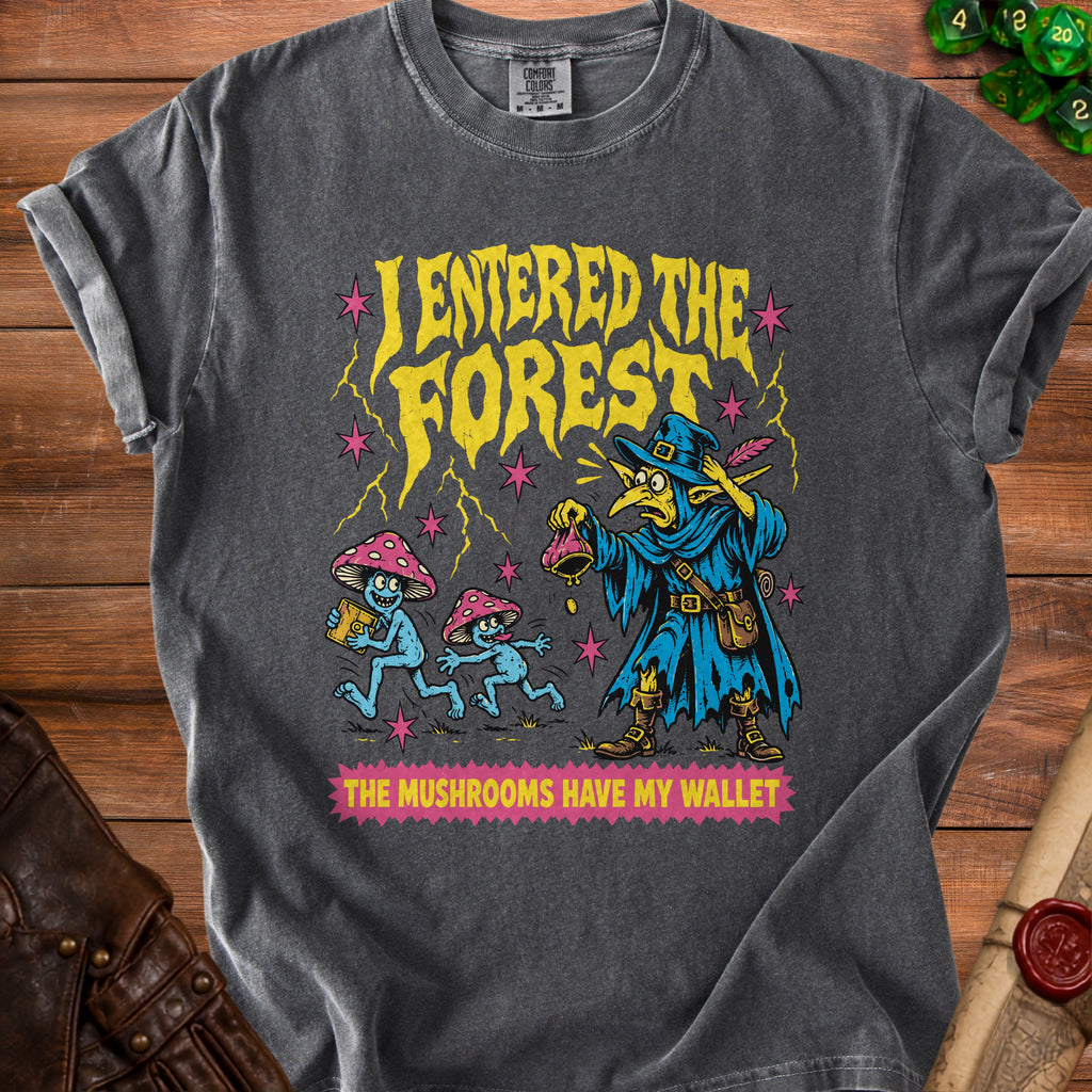 Graphic tee with yellow text "I ENTERED THE FOREST" and mushrooms stealing a wallet.