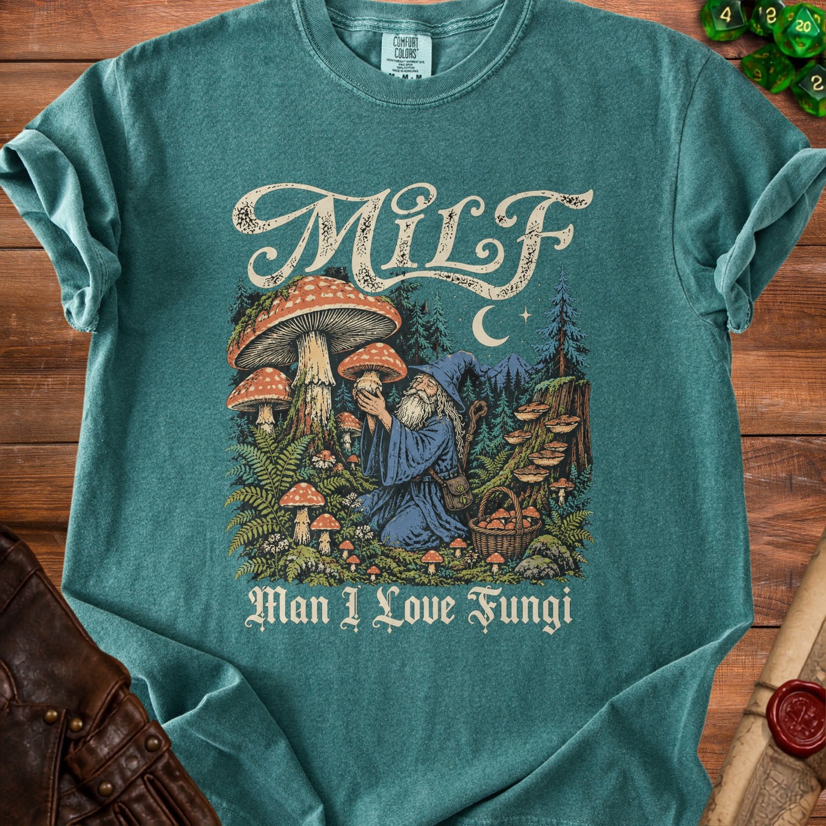 Teal t-shirt with wizard, mushrooms, trees, moon, and text "MiLF Man I Love Fungi".
