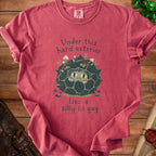 Red t-shirt with graphic: "Under this hard exterior lies a silly lil guy".