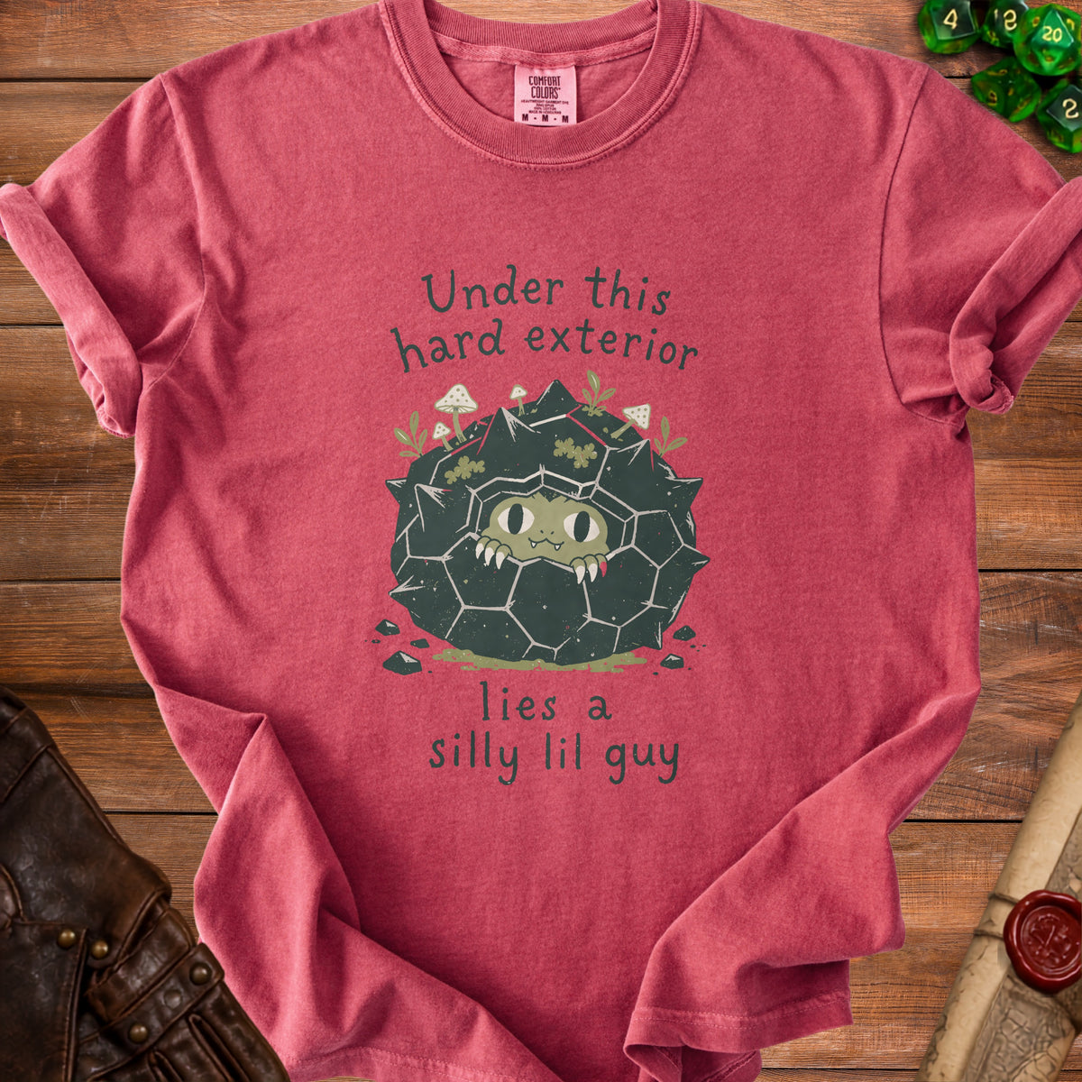 Red t-shirt with graphic: "Under this hard exterior lies a silly lil guy".