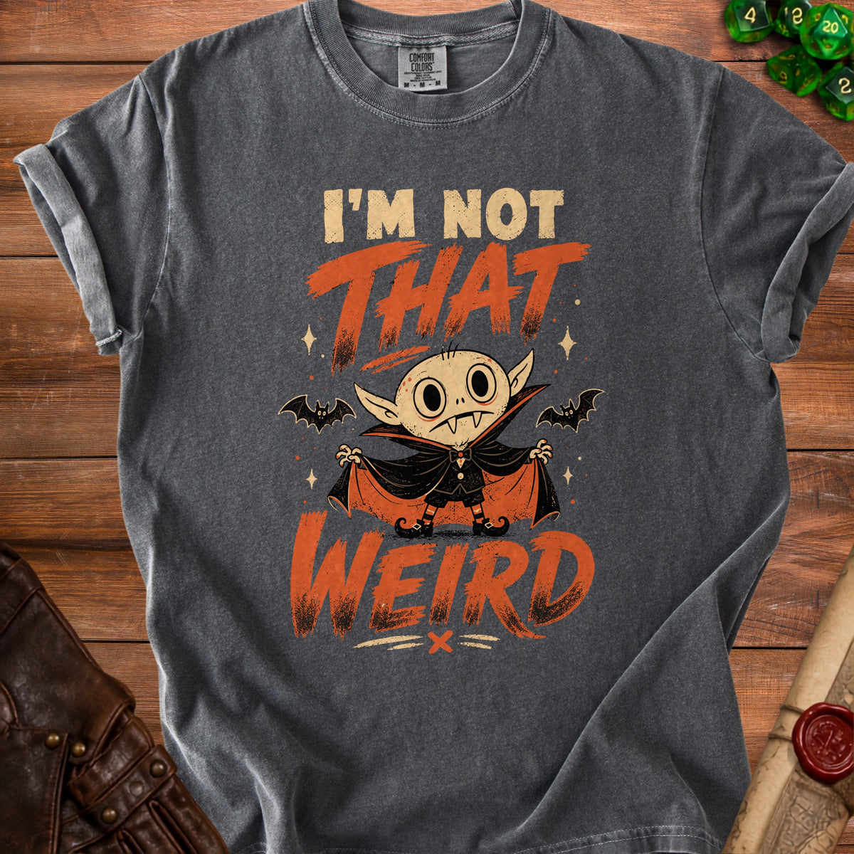 Dark gray t-shirt with cartoon vampire and text "I'm Not That Weird".