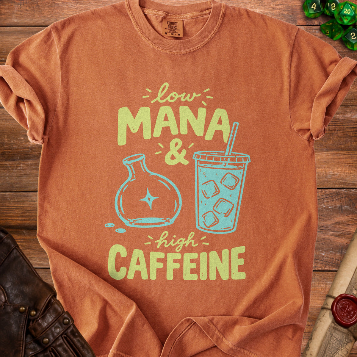 Orange t-shirt with "Low Mana & High Caffeine" text and graphics.