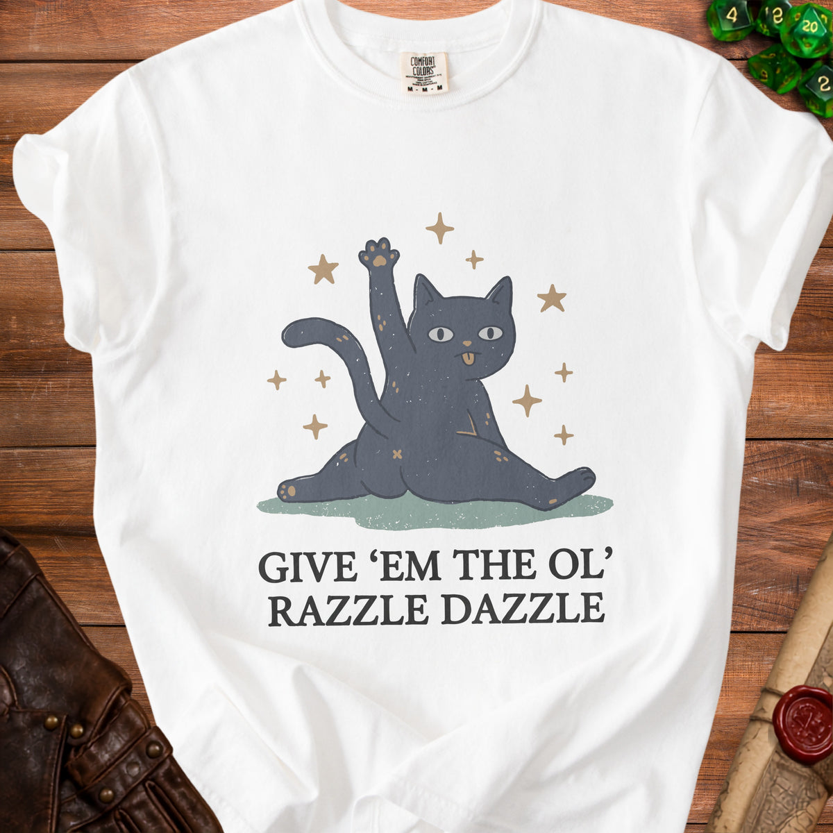 White t-shirt with a cartoon black cat and the text "GIVE 'EM THE OL' RAZZLE DAZZLE".