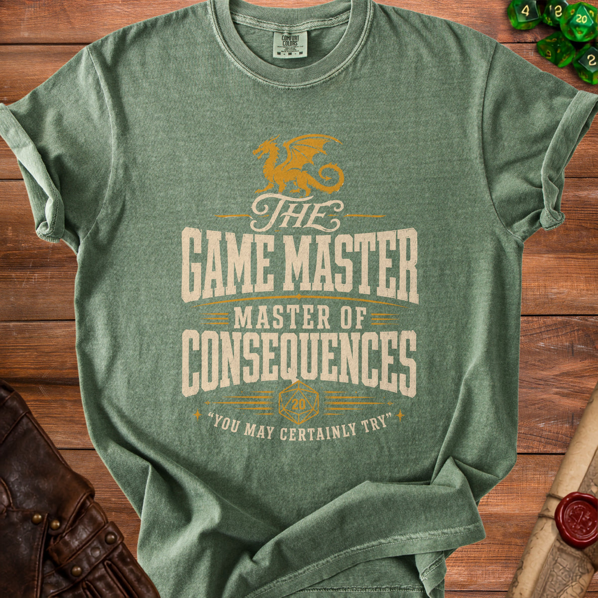 Green t-shirt with "The Game Master Master of Consequences" text and dragon graphic.