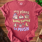 Red shirt with text "my plans have turned to mush" and cartoon mushroom, book, and snail.