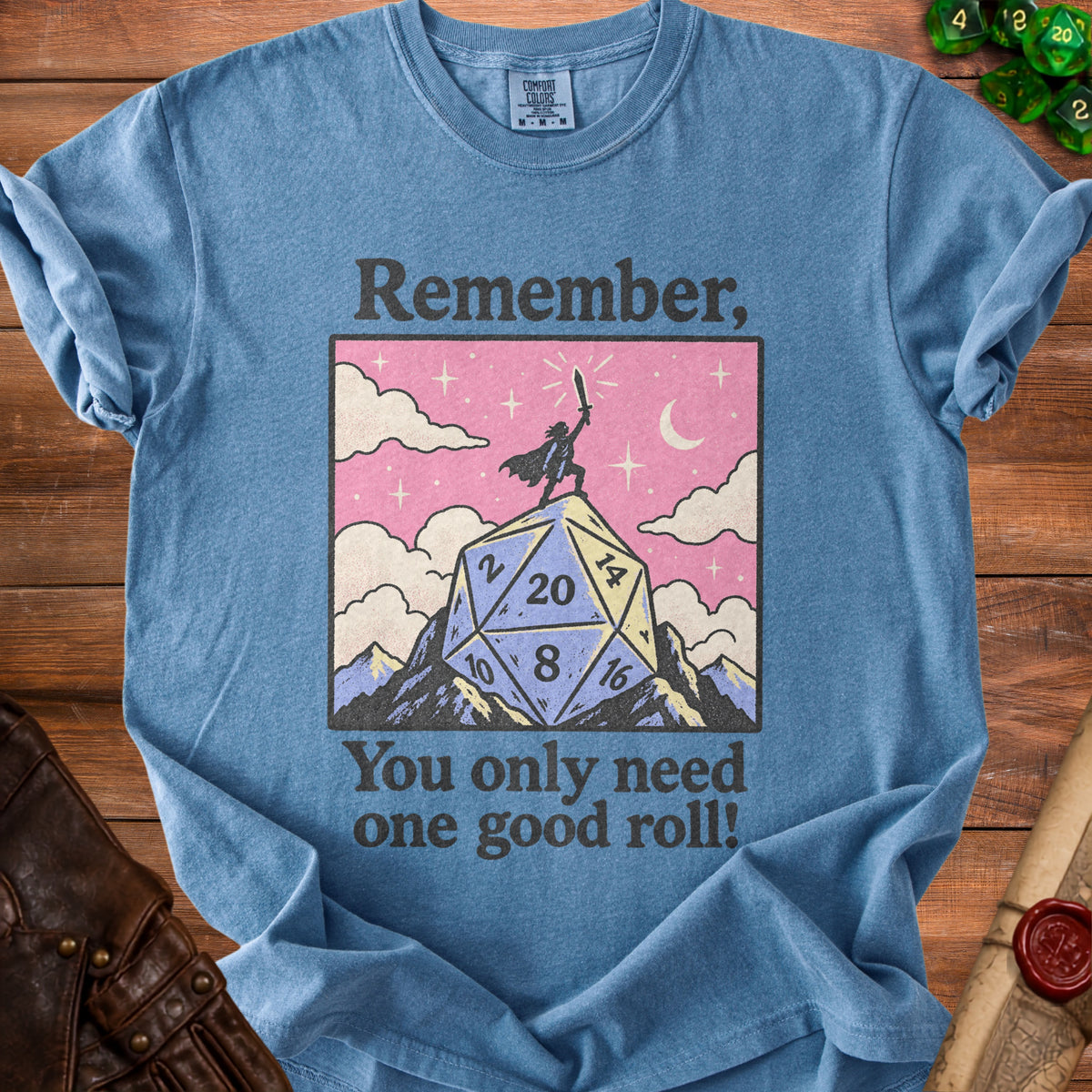 Blue t-shirt with "Remember, You only need one good roll!" and a dice graphic.